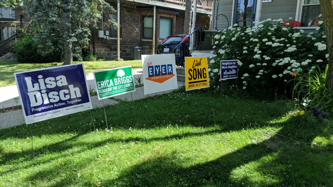 Photo of lawn signs supporting Lisa Disch, Erica Briggs, Jen Eyer & Linh Song for Ann Arbor City Council